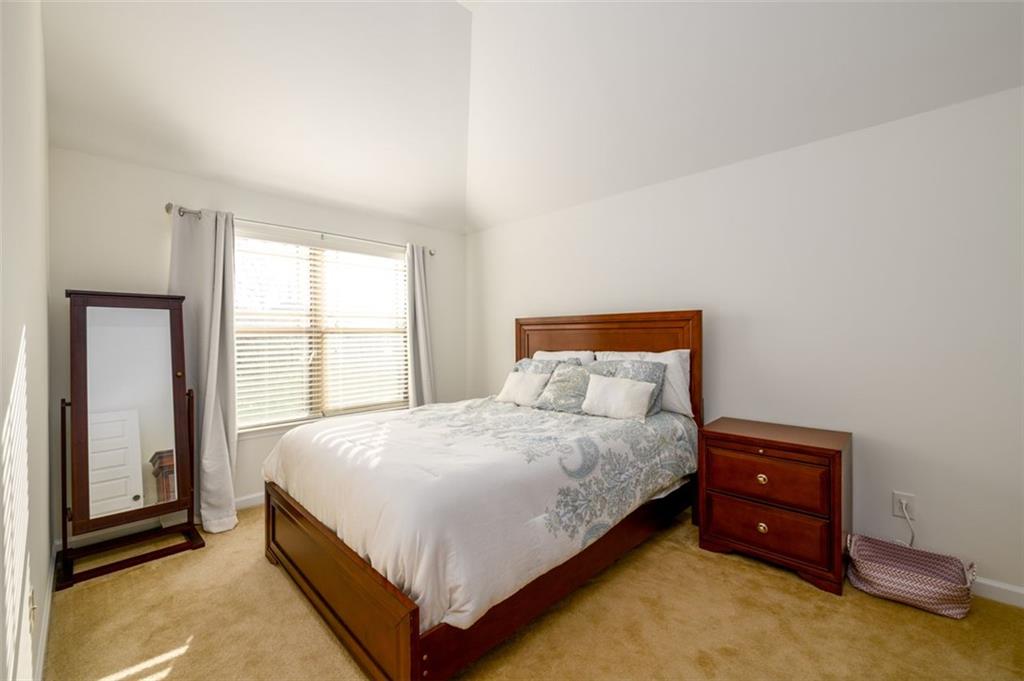 1979 Trinity Mill Drive Dacula, GA 30019 - Photo 25 of 38 a bedroom with a bed and a window