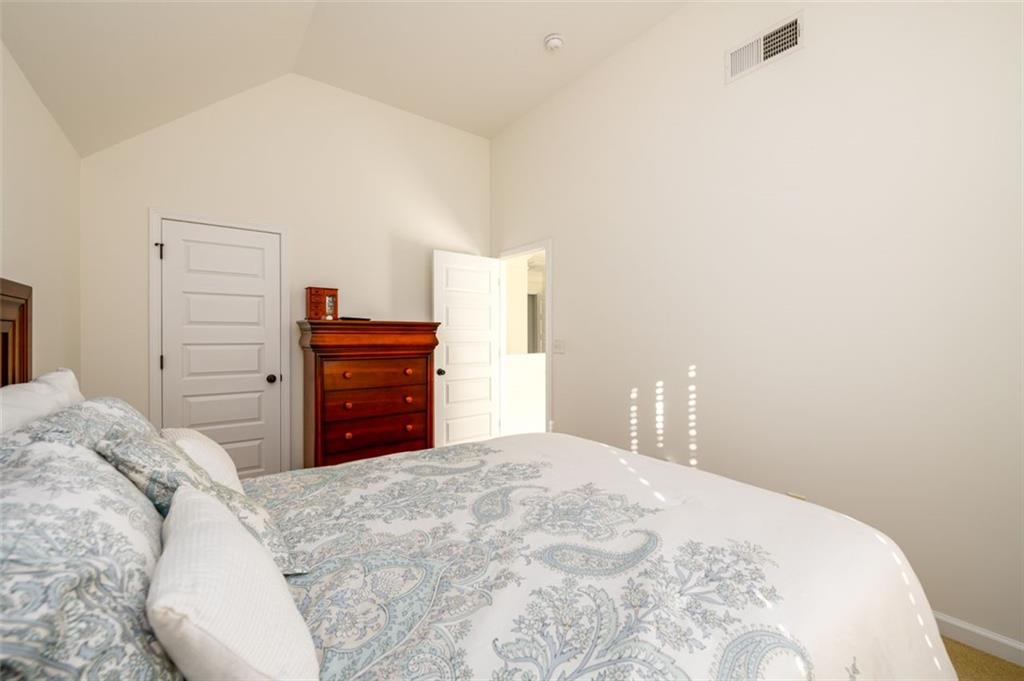 1979 Trinity Mill Drive Dacula, GA 30019 - Photo 26 of 38 a bedroom with a bed and a dresser