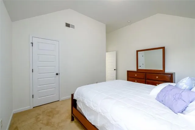 a bedroom with a bed and room