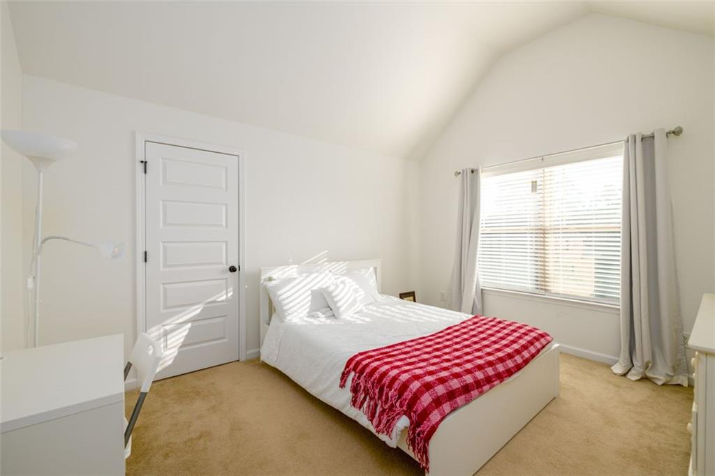 1979 Trinity Mill Drive Dacula, GA 30019 - Photo 29 of 38 a bedroom with a bed and a window