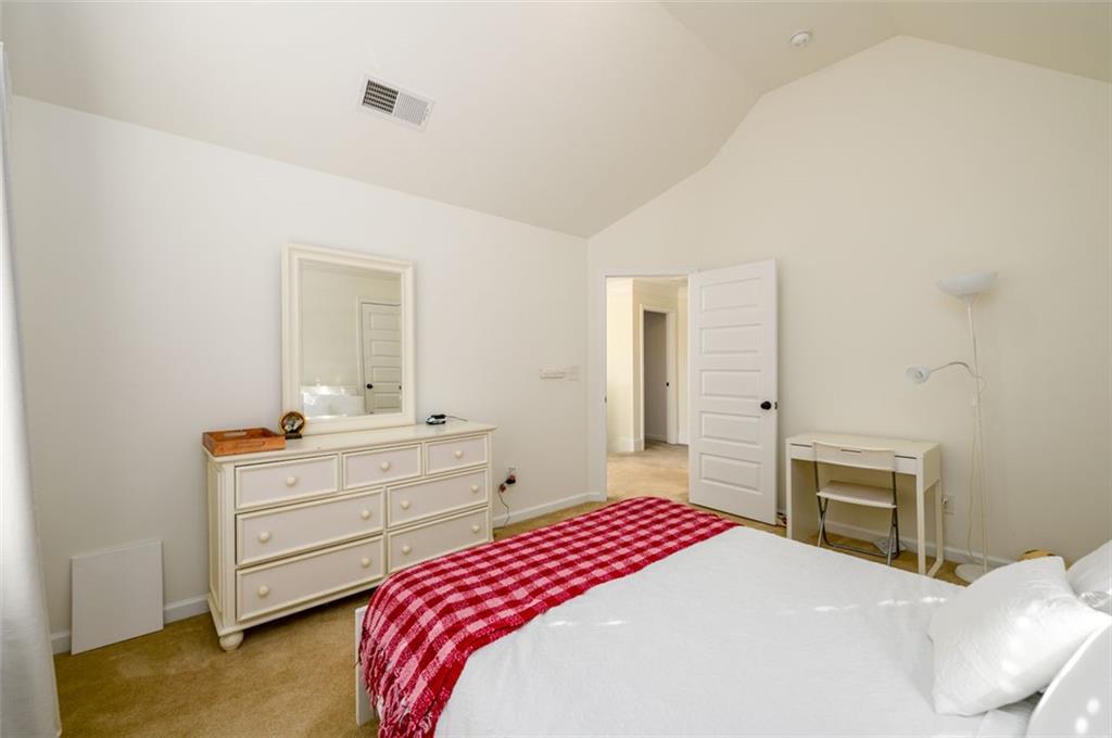 1979 Trinity Mill Drive Dacula, GA 30019 - Photo 30 of 38 a bedroom with a bed and a dresser