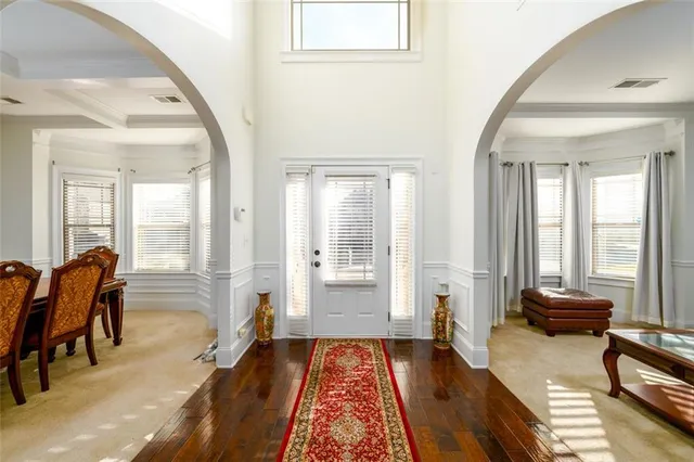 a living room with furniture and a rug