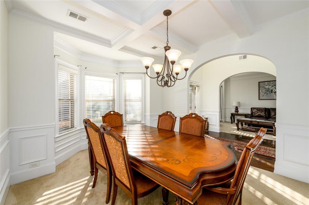 1979 Trinity Mill Drive Dacula, GA 30019 - Photo 9 of 38 a view of a dining room with furniture window and wooden floor