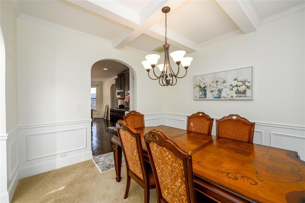 1979 Trinity Mill Drive Dacula, GA 30019 - Photo 10 of 38 a view of a dining room with furniture and chandelier