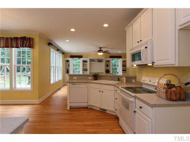 6909 Pinnacle Ridge Road Raleigh, NC 27603 - Photo 9 of 25 Your kitchen looks right into the family room. Enjoy smooth top electric range. Kitchen