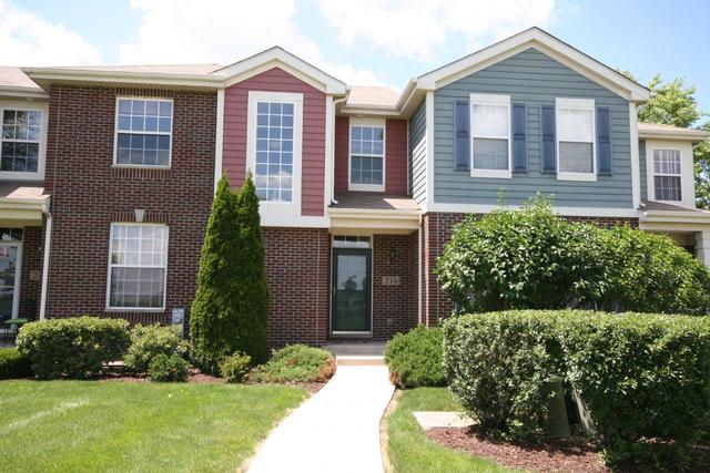 216 Longview Drive Elgin, IL 60124 - Photo 1 of 20 front view of brick house with a yard