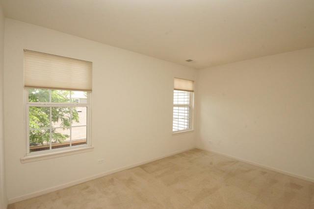 216 Longview Drive Elgin, IL 60124 - Photo 12 of 20 an empty room with windows