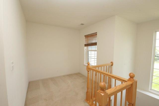 216 Longview Drive Elgin, IL 60124 - Photo 14 of 20 a view of an empty room with stairs