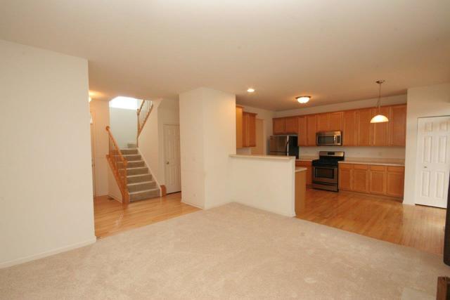 216 Longview Drive Elgin, IL 60124 - Photo 4 of 20 a view of kitchen with furniture and a refrigerator