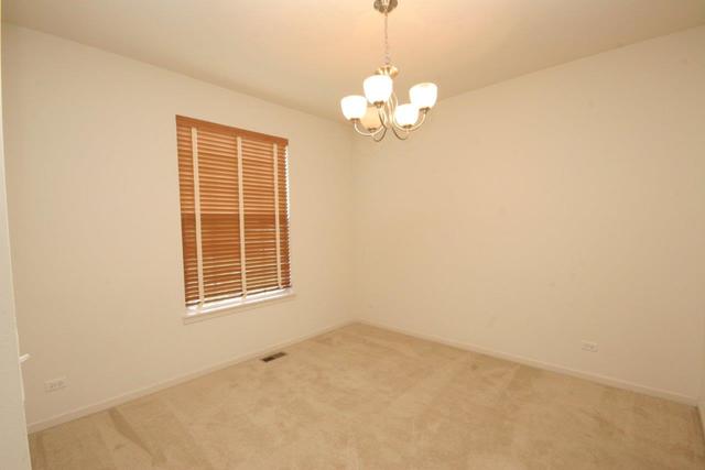 216 Longview Drive Elgin, IL 60124 - Photo 8 of 20 an empty room with a window