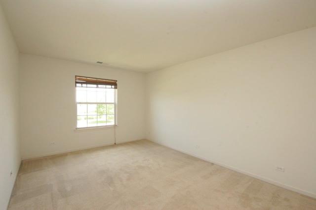 216 Longview Drive Elgin, IL 60124 - Photo 9 of 20 an empty room with a window