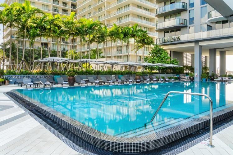 121 Northeast 34th Street, Unit L401 Miami, FL 33137 - Photo 25 of 37 a view of a swimming pool with a patio