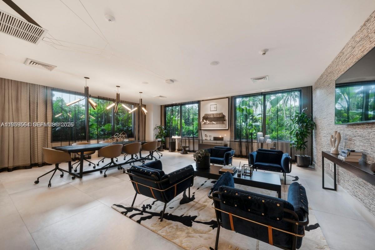 121 Northeast 34th Street, Unit L401 Miami, FL 33137 - Photo 31 of 37 a living room with furniture and a large window