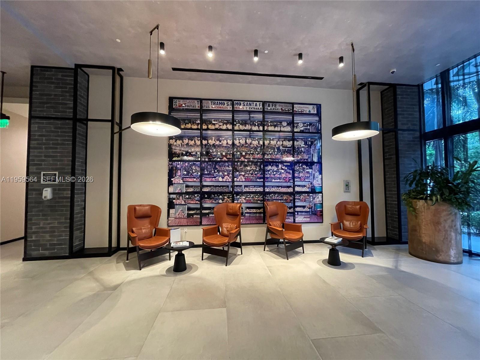 121 Northeast 34th Street, Unit L401 Miami, FL 33137 - Photo 4 of 37 a view of a room with gym equipment