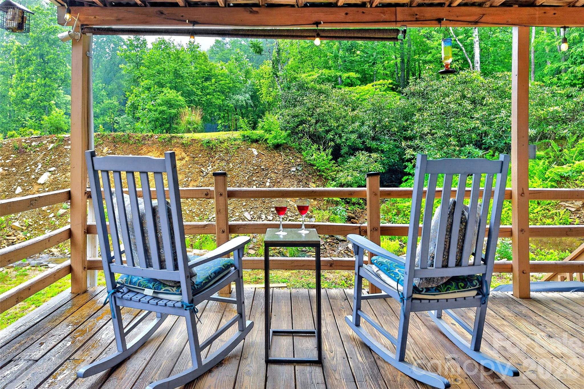 227 Locust Cove Road Marion, NC 28752 - Photo 5 of 34 a view of a chairs and table in the balcony
