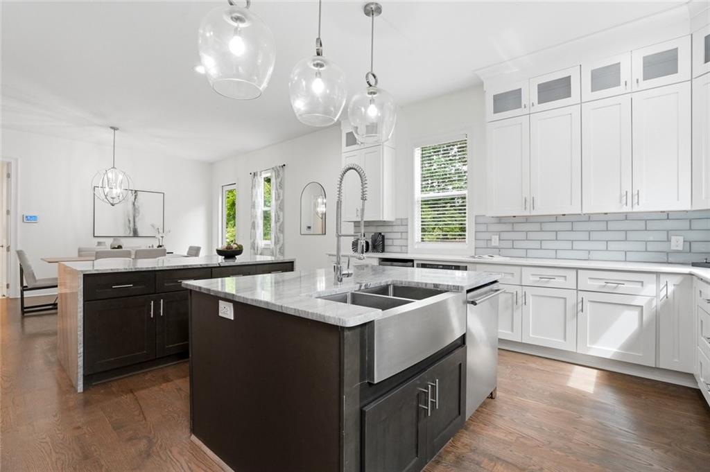 2415 West Rugby Avenue Atlanta, GA 30337 - Photo 10 of 40 a kitchen with a sink stove and cabinets