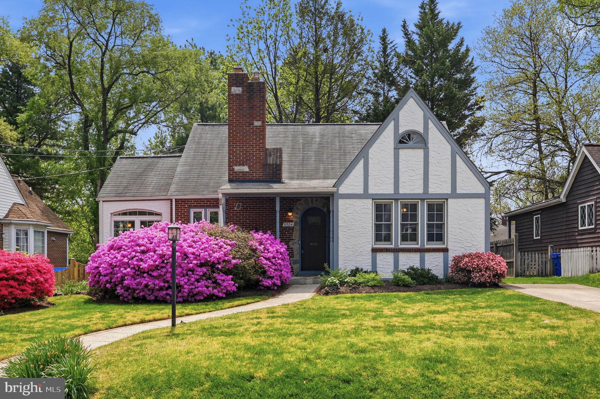 Charming home with vibrant blooms.