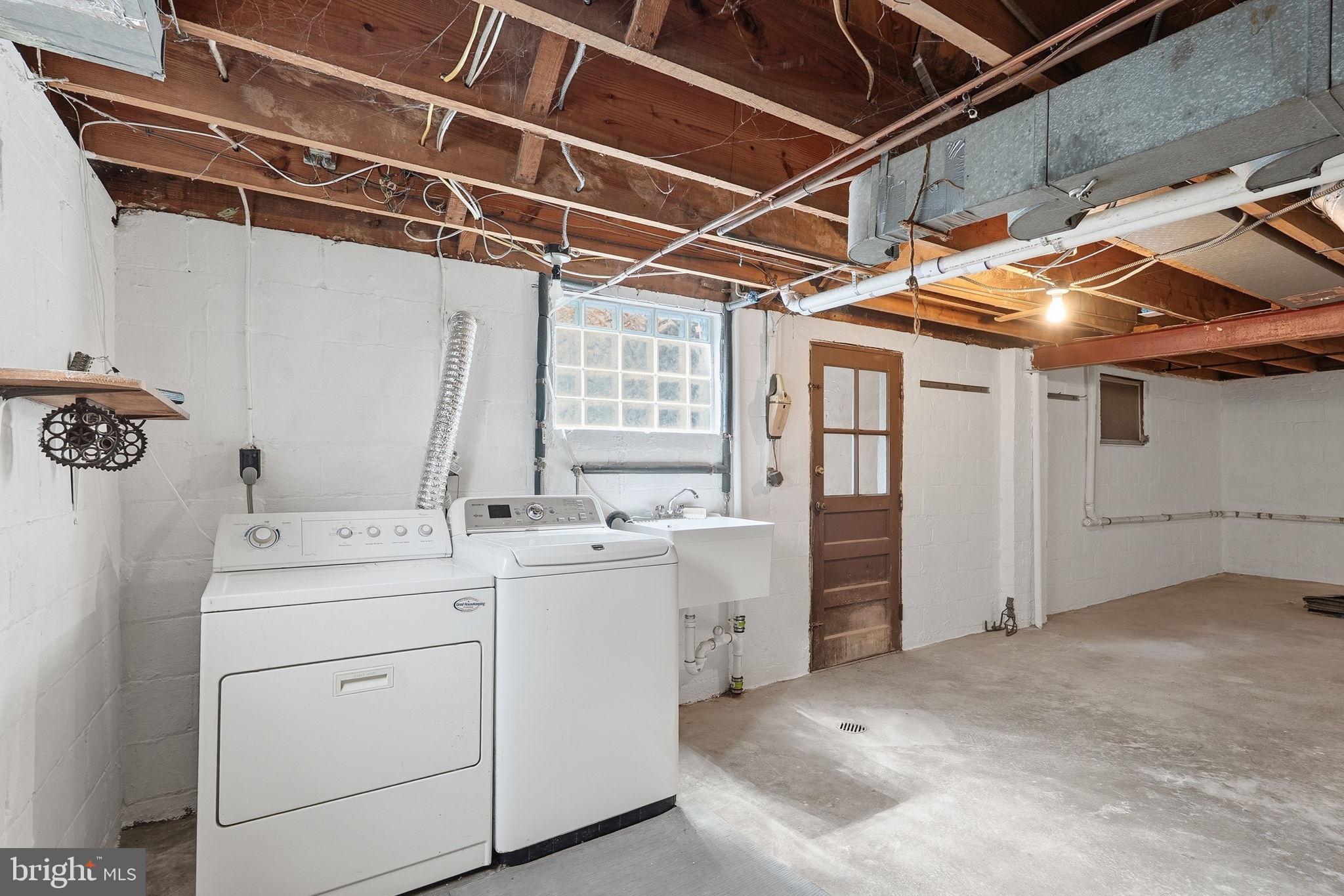 9504 Riley Road Silver Spring, MD 20910 - Photo 21 of 26 Bright and functional laundry space.