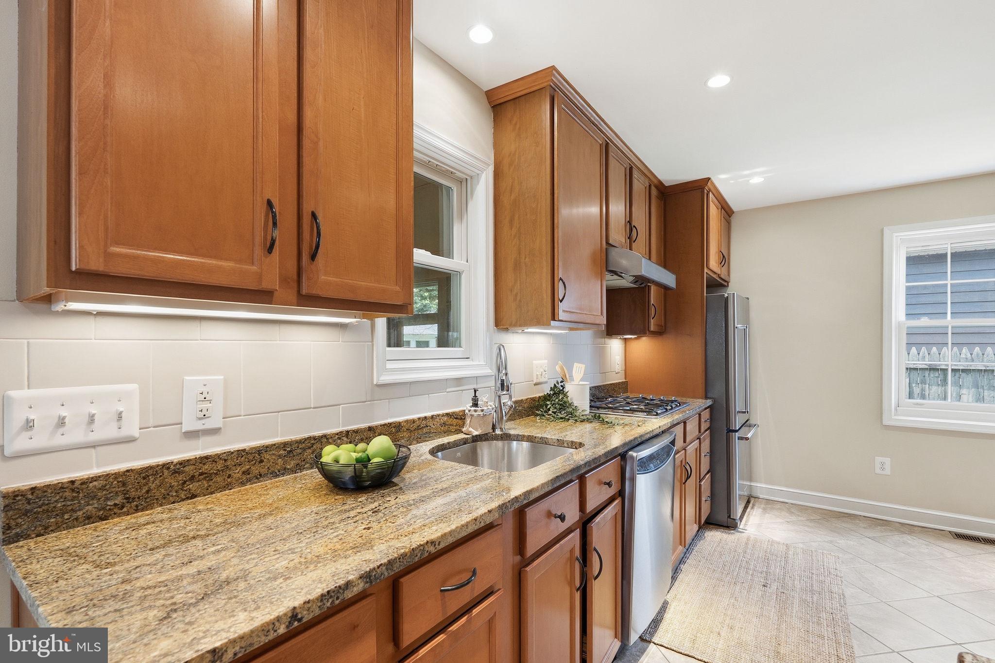 9504 Riley Road Silver Spring, MD 20910 - Photo 5 of 26 Modern kitchen with warm wood tones.