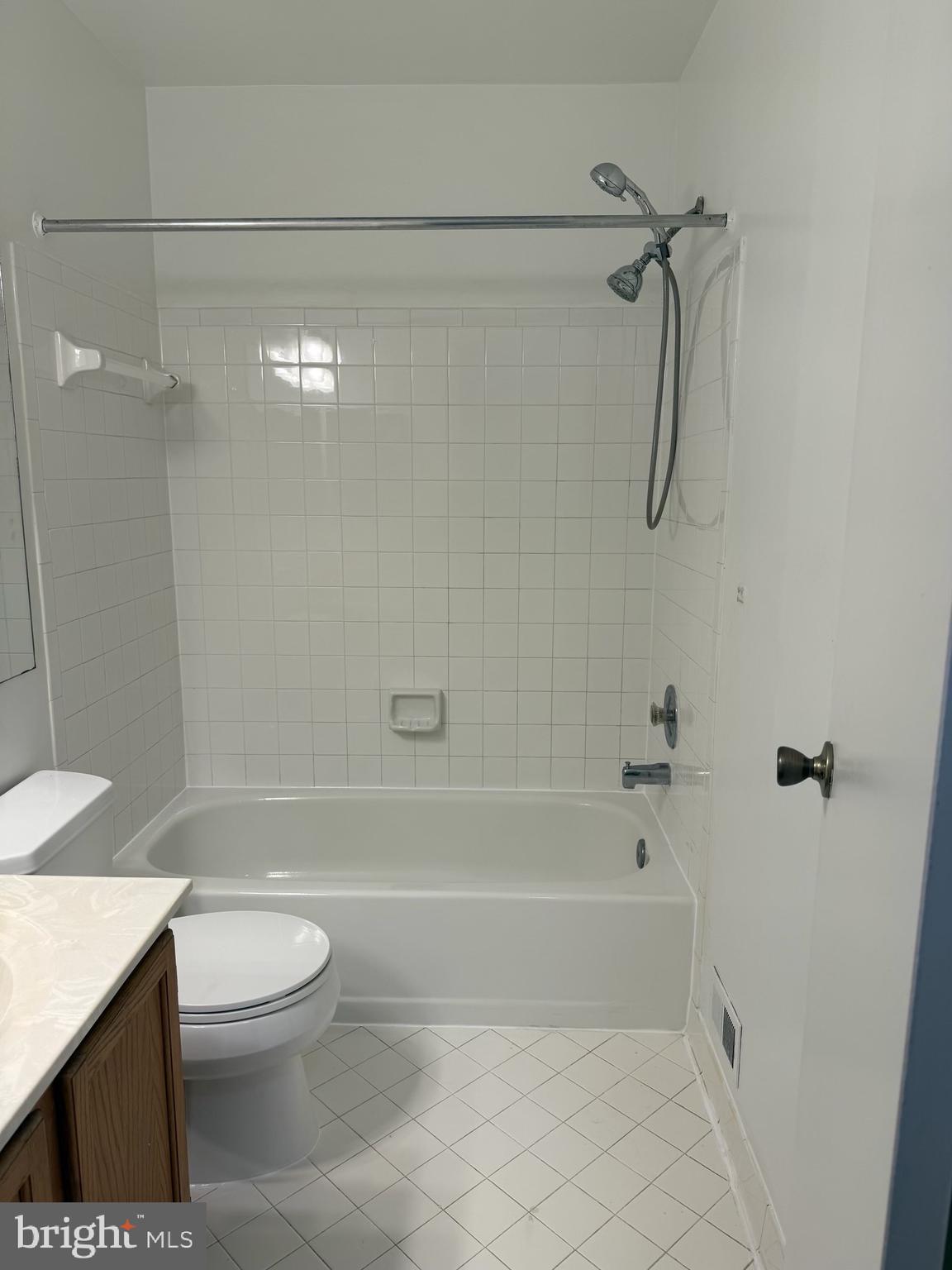18272 Rolling Meadow Way Olney, MD 20832 - Photo 12 of 21 a bathroom with a bathtub a toilet and a shower