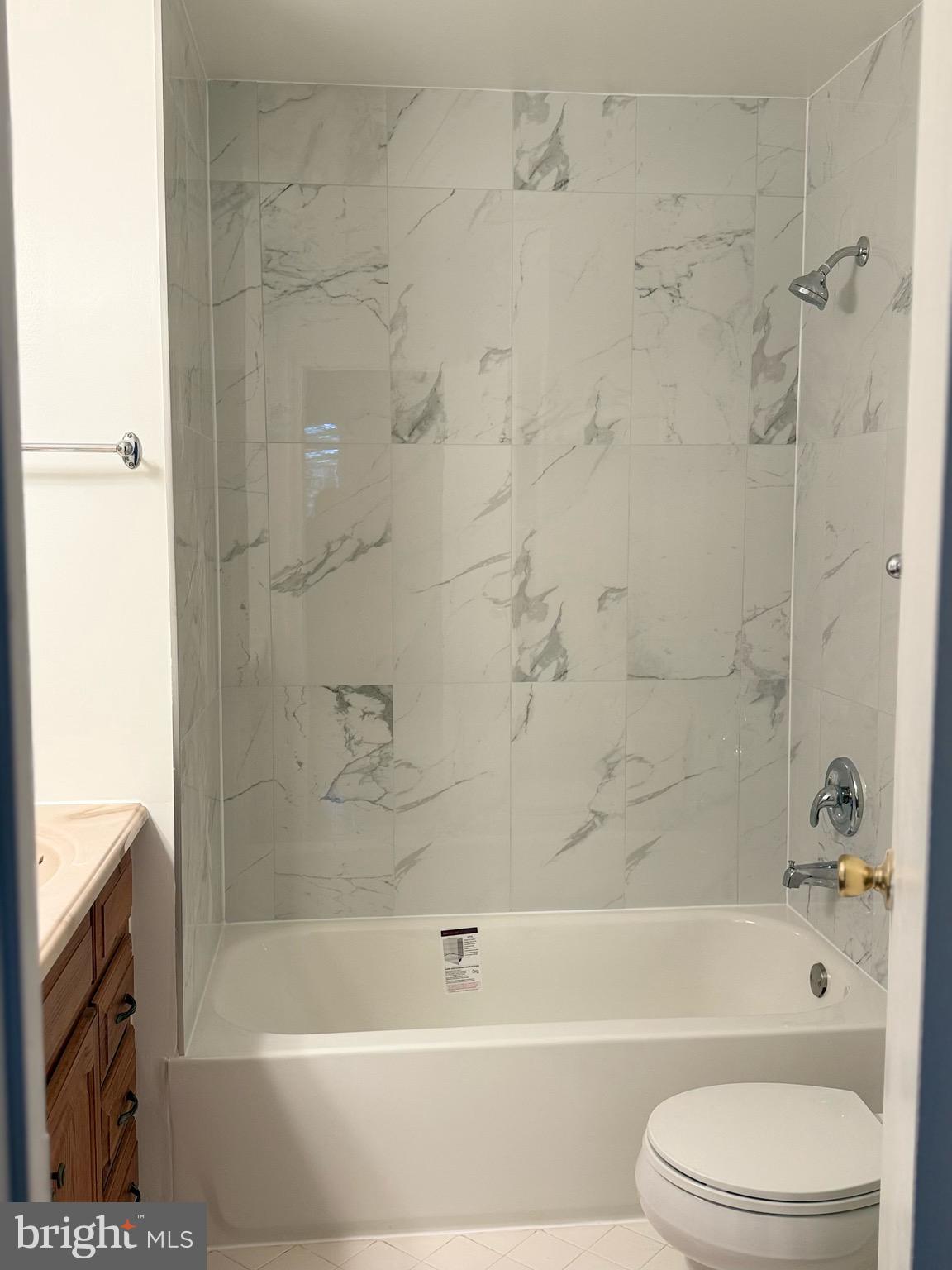 18272 Rolling Meadow Way Olney, MD 20832 - Photo 18 of 21 a bathroom with a bathtub toilet and shower