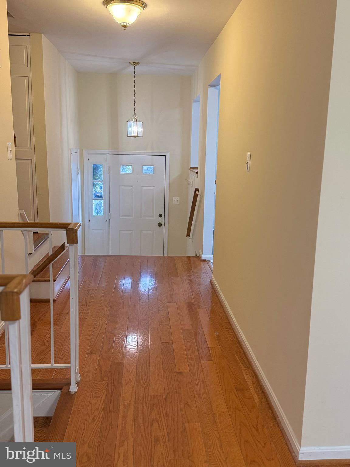 18272 Rolling Meadow Way Olney, MD 20832 - Photo 3 of 21 a view of a livingroom with wooden floor