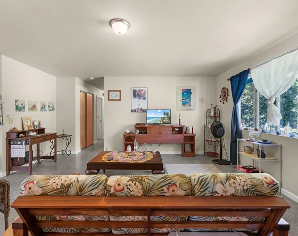 a dining room with furniture window and entryway