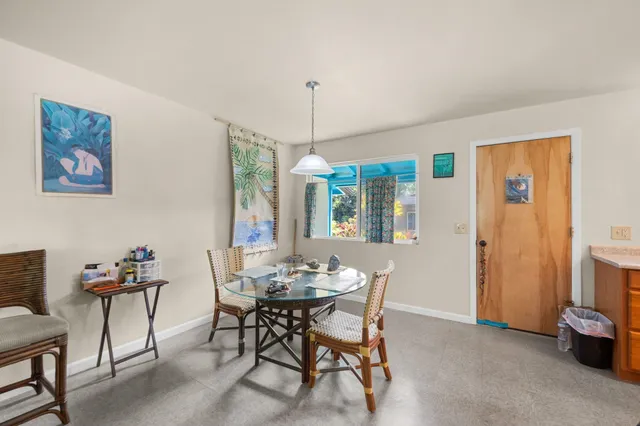 a kitchen with a sink stove and a refrigerator