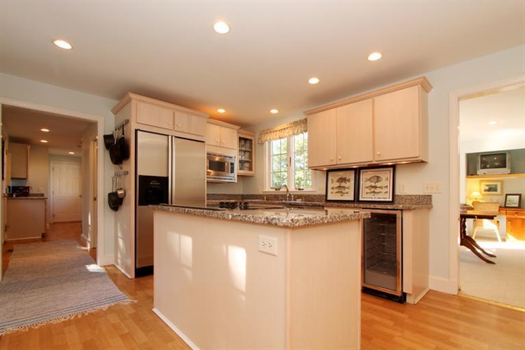 123 Strong Island Road Chatham, MA 02633 - Photo 11 of 34 a kitchen with stainless steel appliances granite countertop a refrigerator a stove and a sink