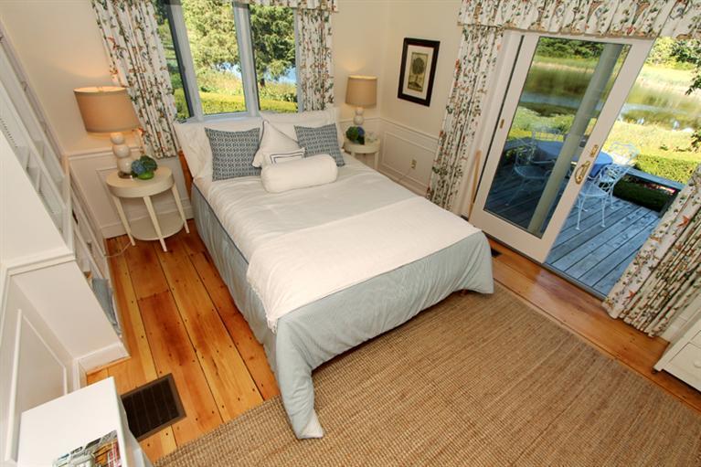 123 Strong Island Road Chatham, MA 02633 - Photo 14 of 34 a bed sitting in a bedroom next to a window