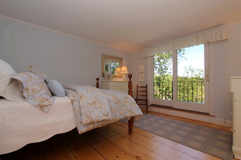 123 Strong Island Road Chatham, MA 02633 - Photo 15 of 34 a bed sitting in a bedroom next to a window
