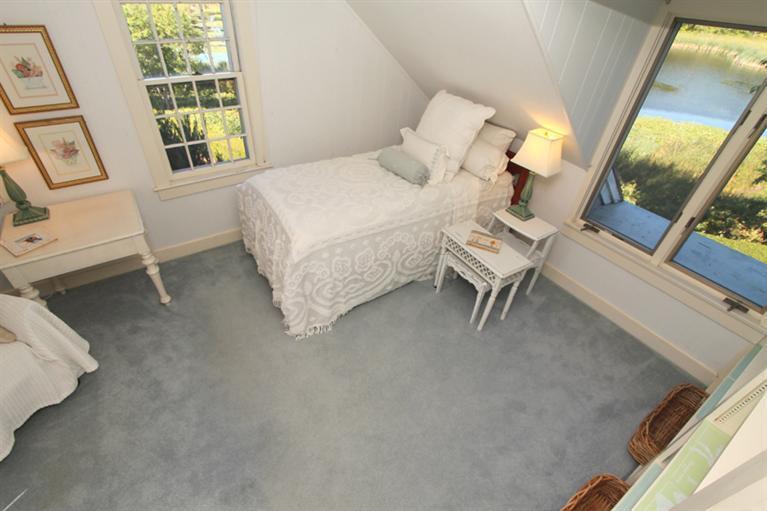 123 Strong Island Road Chatham, MA 02633 - Photo 19 of 34 a bedroom with a bed and a large window