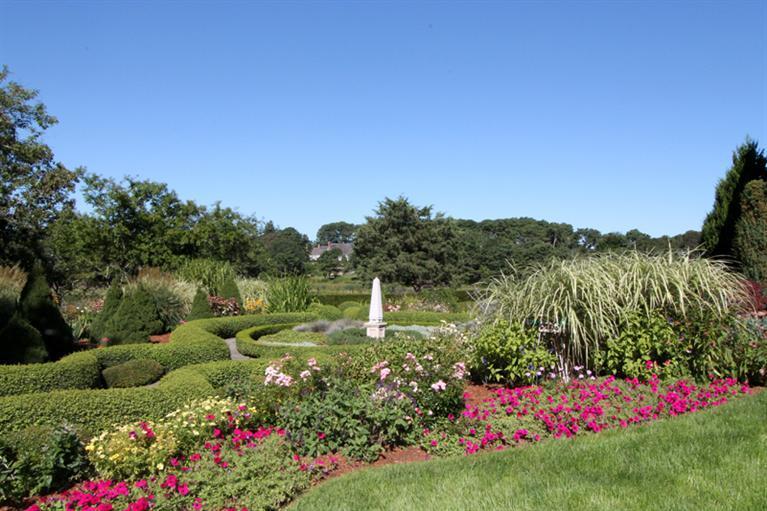123 Strong Island Road Chatham, MA 02633 - Photo 31 of 34 a view of a garden with flowers and trees all around
