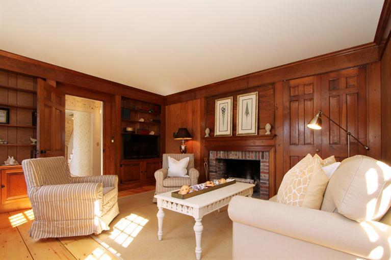 123 Strong Island Road Chatham, MA 02633 - Photo 8 of 34 a living room with furniture and a fireplace