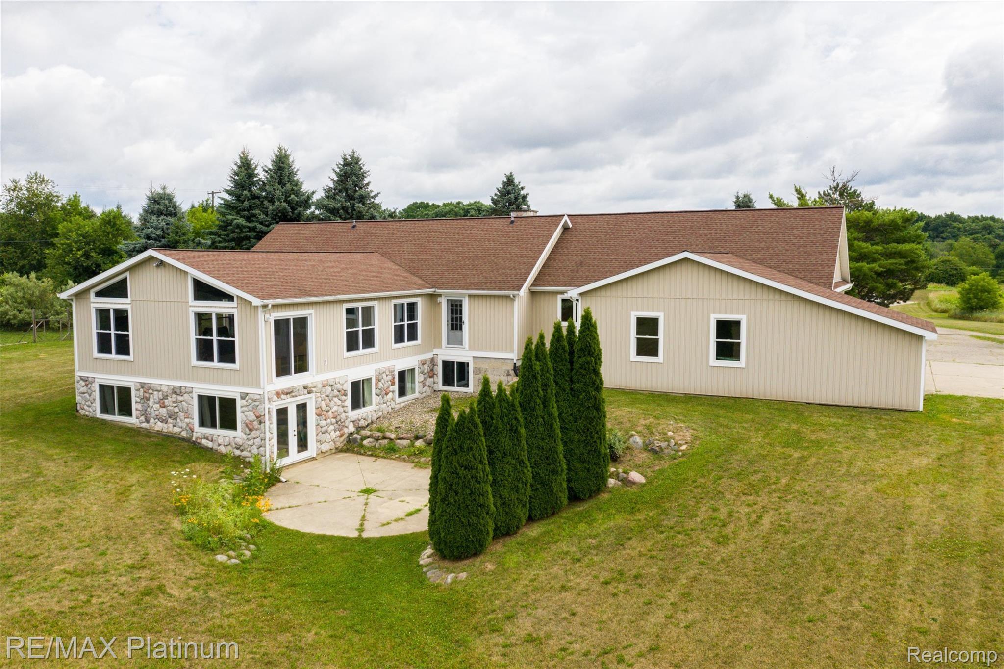 593 North Hacker Road Howell, MI 48843 - Photo 41 of 48 A great view of the large patio!