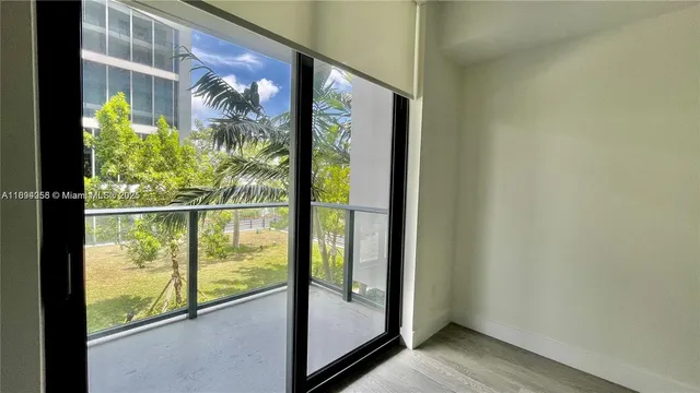 a view of a glass door and a window