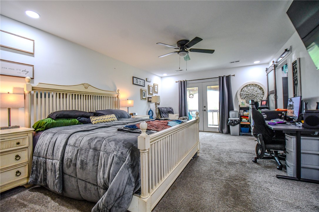 6169 Dayton Farmersville Road Dayton, OH 45417 - Photo 26 of 64 This spacious bedroom offers ample comfort and direct access to outdoor serenity.