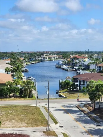a front view of building and lake view