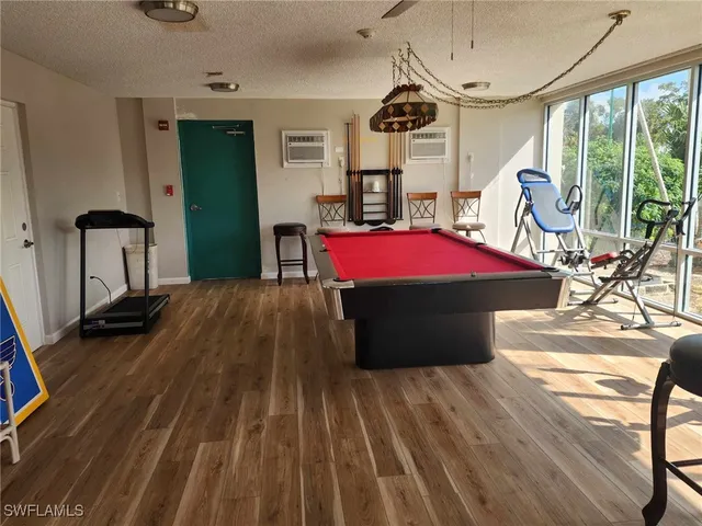 a living room with hardwood floor and windows