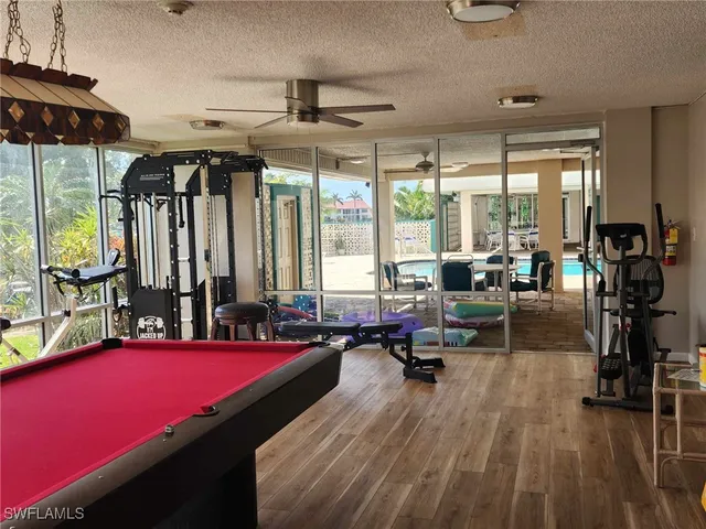 a living room with furniture flat screen tv and a fireplace
