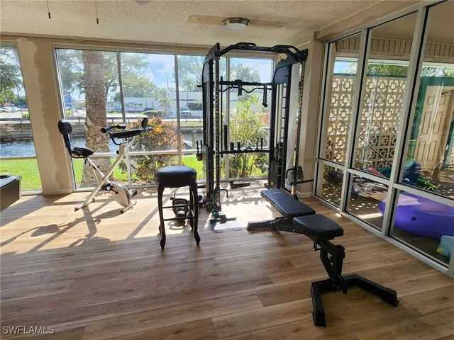 a white refrigerator freezer and a stove sitting inside of a kitchen