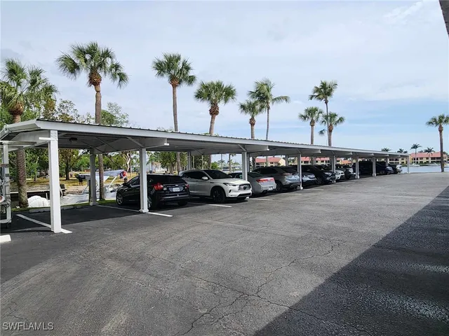 a view of a lake with houses in the back