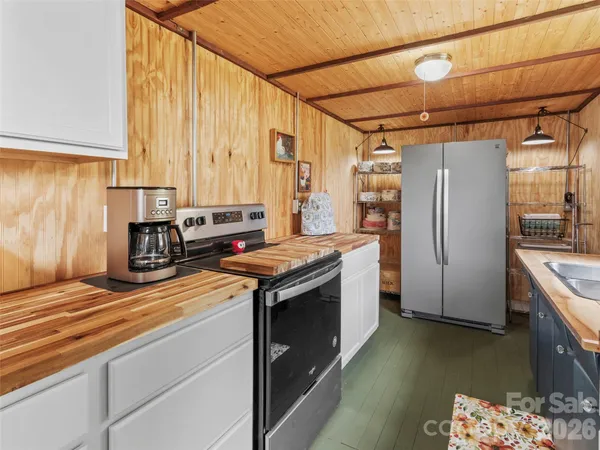 a kitchen with a stove and a refrigerator