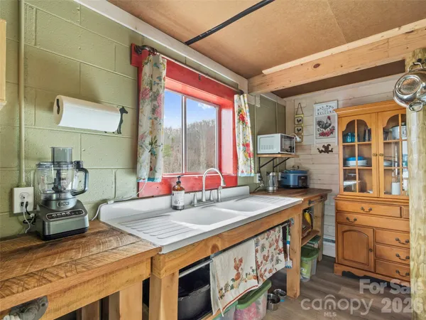 a kitchen with a stove a sink and a refrigerator