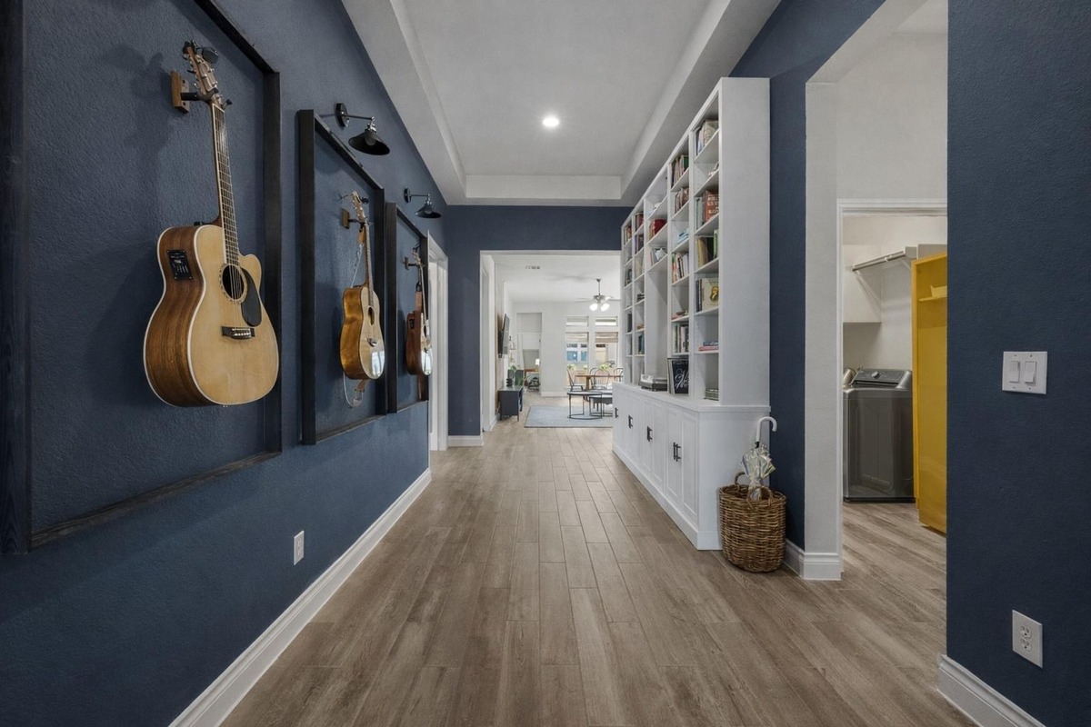 1136 Stetson Hat Trail Georgetown, TX 78628 - Photo 22 of 40 a view of a hallway with wooden floor and windows