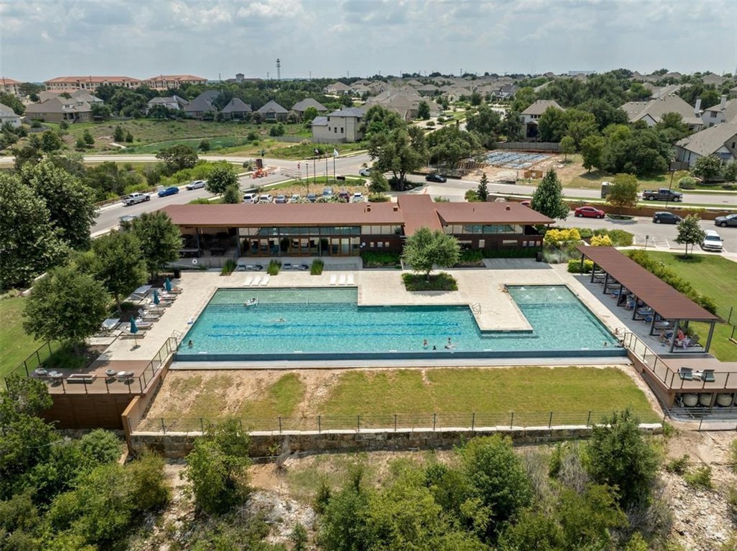 1136 Stetson Hat Trail Georgetown, TX 78628 - Photo 35 of 40 an aerial view of a house with a yard and lake view