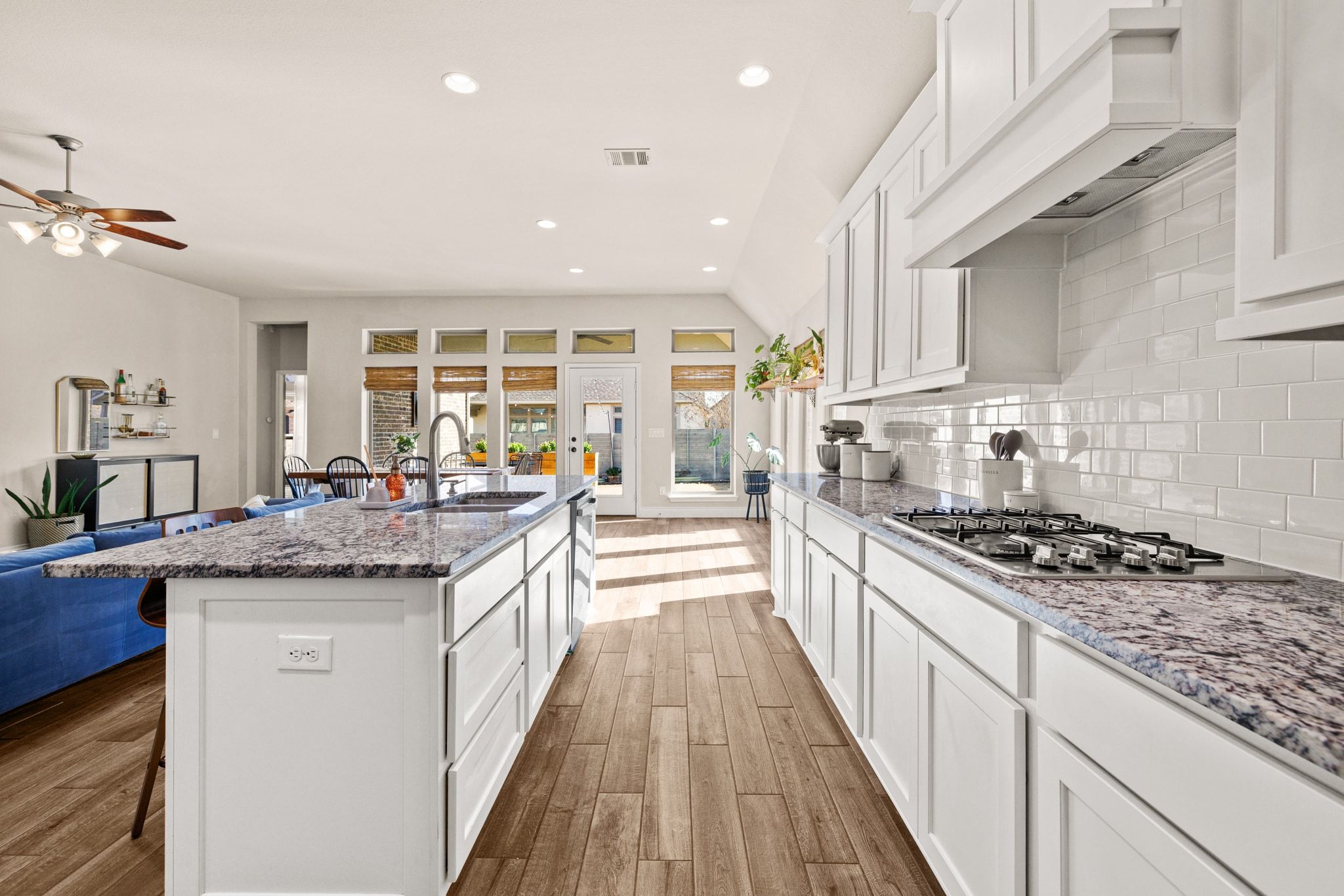 1136 Stetson Hat Trail Georgetown, TX 78628 - Photo 6 of 40 a large kitchen with stainless steel appliances granite countertop a stove and a sink