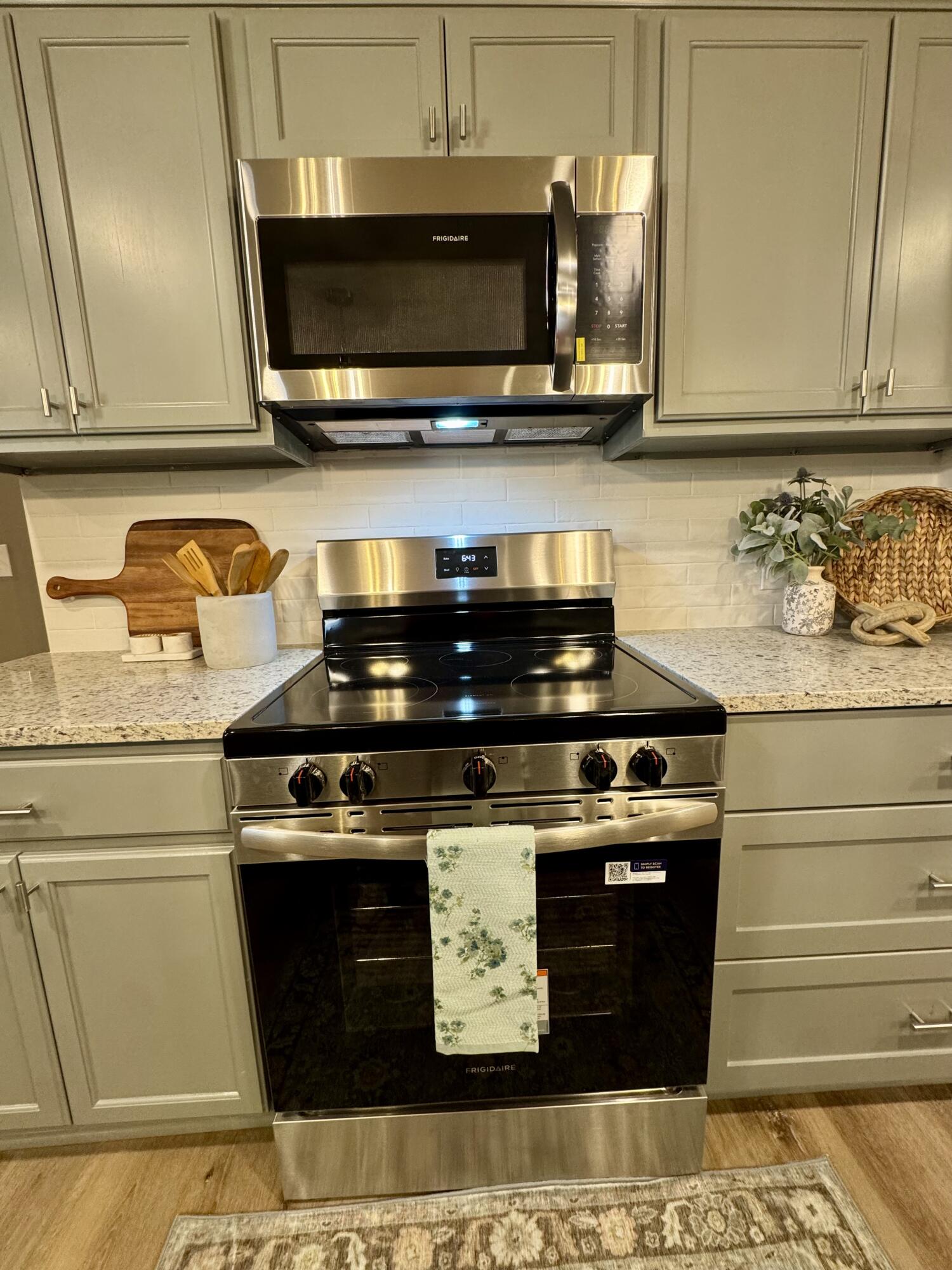 106 North 22nd Place Lamesa, TX 79331 - Photo 16 of 82 a stove top oven sitting inside of a kitchen