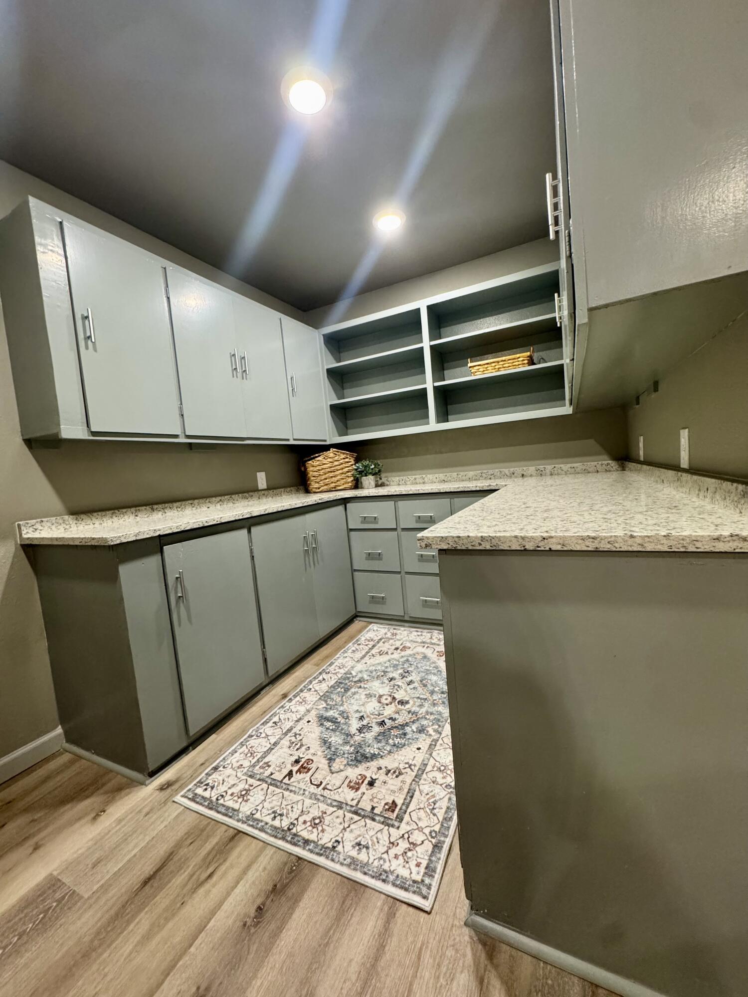 106 North 22nd Place Lamesa, TX 79331 - Photo 21 of 82 a view of kitchen with microwave and cabinets