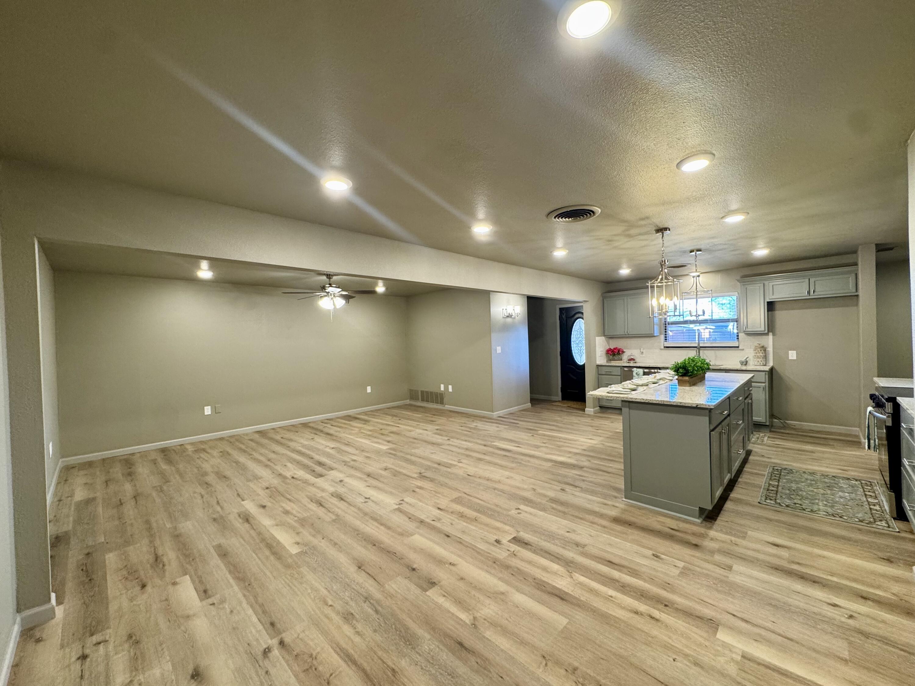 106 North 22nd Place Lamesa, TX 79331 - Photo 26 of 82 a kitchen with a refrigerator and a counter top space